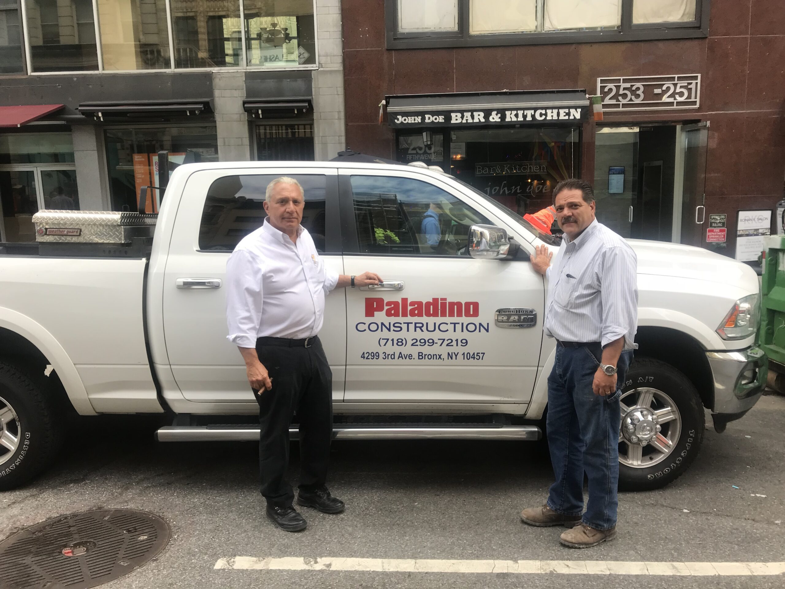 Two Man Standing in Front of the Car